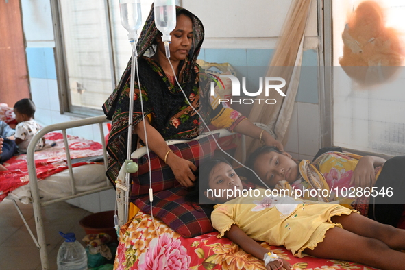 

Patients suffering from dengue fever are being treated inside the Mugdha General Hospital's admission section in Dhaka, Bangladesh on July...