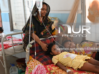 

Patients suffering from dengue fever are being treated inside the Mugdha General Hospital's admission section in Dhaka, Bangladesh on July...