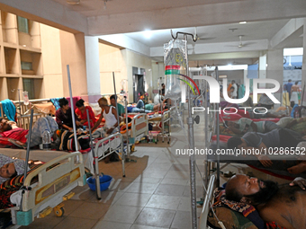 

Patients suffering from dengue fever are being treated inside the Mugdha General Hospital's admission section in Dhaka, Bangladesh on July...