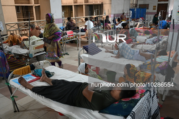 

Patients suffering from dengue fever are being treated inside the Mugdha General Hospital's admission section in Dhaka, Bangladesh on July...