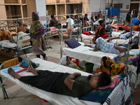 

Patients suffering from dengue fever are being treated inside the Mugdha General Hospital's admission section in Dhaka, Bangladesh on July...