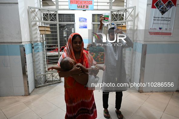 

Patients suffering from dengue fever are being treated inside the Mugdha General Hospital's admission section in Dhaka, Bangladesh on July...