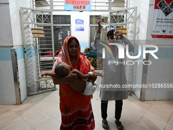 

Patients suffering from dengue fever are being treated inside the Mugdha General Hospital's admission section in Dhaka, Bangladesh on July...