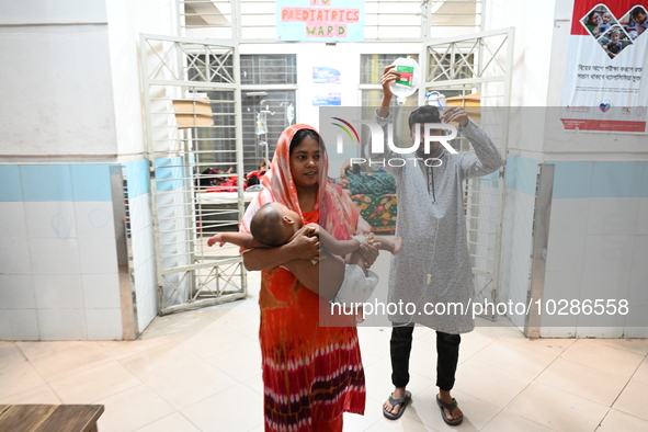 

Patients suffering from dengue fever are being treated inside the Mugdha General Hospital's admission section in Dhaka, Bangladesh on July...