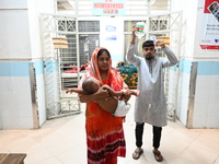 

Patients suffering from dengue fever are being treated inside the Mugdha General Hospital's admission section in Dhaka, Bangladesh on July...