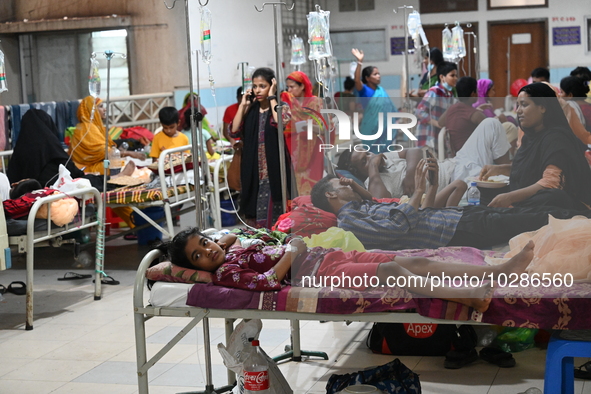 

Patients suffering from dengue fever are being treated inside the Mugdha General Hospital's admission section in Dhaka, Bangladesh on July...