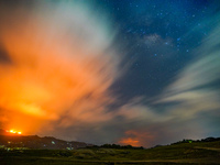 A mountain wildfire and milky way seen from a Teldeniya old town in Kandy, Sri Lanka, on July  22, 2023 (