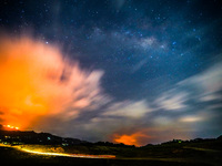 A mountain wildfire and milky way seen from a Teldeniya old town in Kandy, Sri Lanka, on July  22, 2023 (