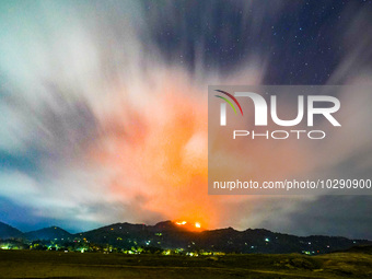 A mountain wildfire and milky way seen from a Teldeniya old town in Kandy, Sri Lanka, on July  22, 2023 (