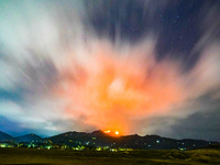 A mountain wildfire and milky way seen from a Teldeniya old town in Kandy, Sri Lanka, on July  22, 2023 (