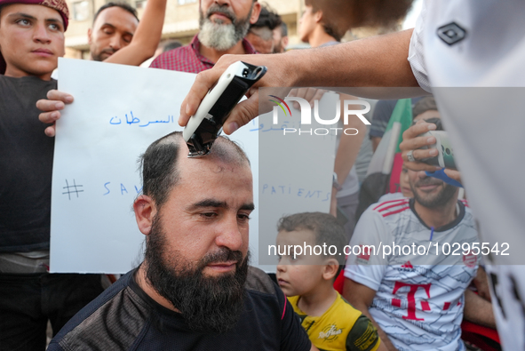 Solidarity with cancer patients in Afrin, northwestern Syria,on july 23, 2023,  as they shave their hair in support of cancer patients exper...