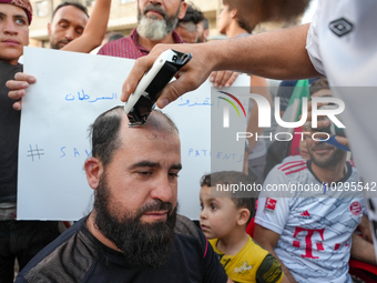 Solidarity with cancer patients in Afrin, northwestern Syria,on july 23, 2023,  as they shave their hair in support of cancer patients exper...