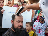 Solidarity with cancer patients in Afrin, northwestern Syria,on july 23, 2023,  as they shave their hair in support of cancer patients exper...