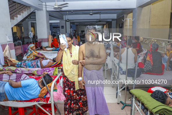 People suffering from dengue fever as they admitted for treatment at a government hospital in Dhaka, Bangladesh, on July 26, 2023. The dengu...