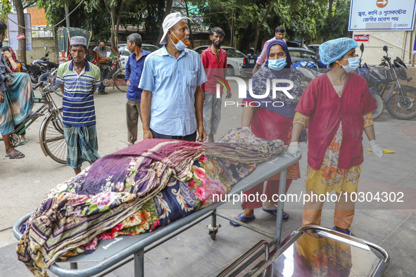 People suffering from dengue fever as they admitted for treatment at a government hospital in Dhaka, Bangladesh, on July 26, 2023. The dengu...