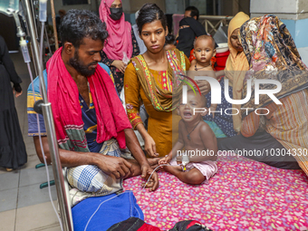 People suffering from dengue fever as they admitted for treatment at a government hospital in Dhaka, Bangladesh, on July 26, 2023. The dengu...