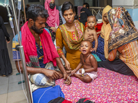 People suffering from dengue fever as they admitted for treatment at a government hospital in Dhaka, Bangladesh, on July 26, 2023. The dengu...