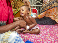 People suffering from dengue fever as they admitted for treatment at a government hospital in Dhaka, Bangladesh, on July 26, 2023. The dengu...