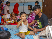 People suffering from dengue fever as they admitted for treatment at a government hospital in Dhaka, Bangladesh, on July 26, 2023. The dengu...