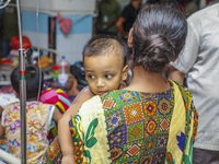 People suffering from dengue fever as they admitted for treatment at a government hospital in Dhaka, Bangladesh, on July 26, 2023. The dengu...