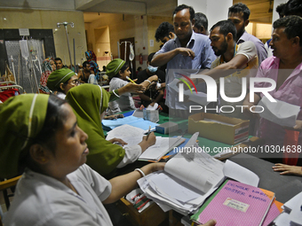 People suffering from dengue fever as they admitted for treatment at a government hospital in Dhaka, Bangladesh, on July 26, 2023. The dengu...