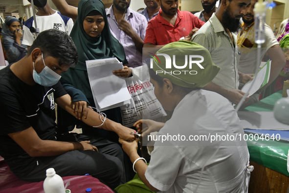 People suffering from dengue fever as they admitted for treatment at a government hospital in Dhaka, Bangladesh, on July 26, 2023. The dengu...