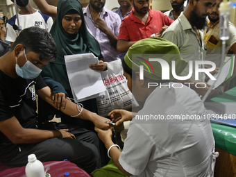 People suffering from dengue fever as they admitted for treatment at a government hospital in Dhaka, Bangladesh, on July 26, 2023. The dengu...