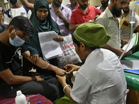 People suffering from dengue fever as they admitted for treatment at a government hospital in Dhaka, Bangladesh, on July 26, 2023. The dengu...