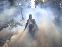 A city corporation worker fumigates as the mosquito-borne dengue infection situation worsens in Dhaka, Bangladesh on July 26, 2023. At least...