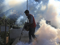 A city corporation worker fumigates as the mosquito-borne dengue infection situation worsens in Dhaka, Bangladesh on July 26, 2023. At least...