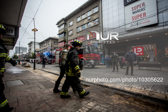 
Firefighters respond to a gas explosion emergency at a residential building in Osorno on July 26, 2023. 