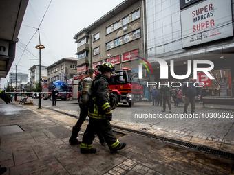 
Firefighters respond to a gas explosion emergency at a residential building in Osorno on July 26, 2023. (