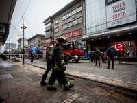 
Firefighters respond to a gas explosion emergency at a residential building in Osorno on July 26, 2023. (