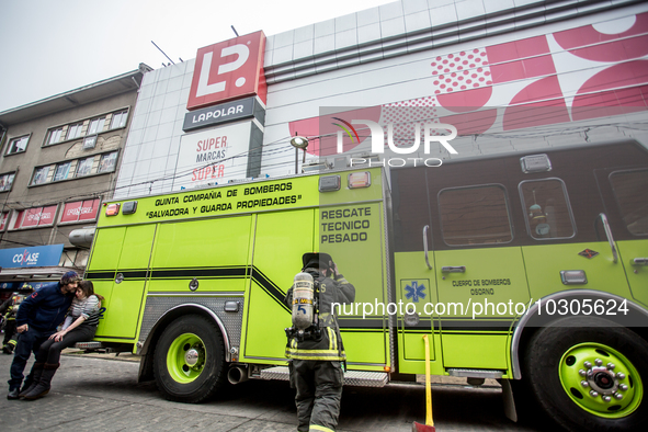 
Firefighters respond to a gas explosion emergency at a residential building in Osorno on July 26, 2023. 