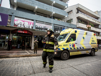 
Firefighters respond to a gas explosion emergency at a residential building in Osorno on July 26, 2023. (