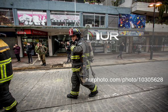 
Firefighters respond to a gas explosion emergency at a residential building in Osorno on July 26, 2023. 