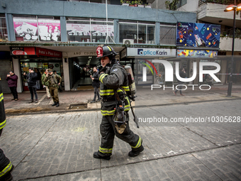 
Firefighters respond to a gas explosion emergency at a residential building in Osorno on July 26, 2023. (