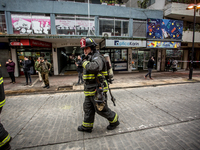 
Firefighters respond to a gas explosion emergency at a residential building in Osorno on July 26, 2023. (