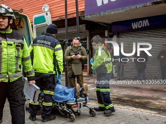 
Firefighters respond to a gas explosion emergency at a residential building in Osorno on July 26, 2023. (