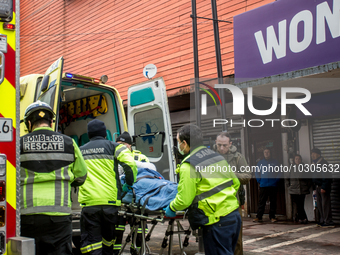 
Firefighters respond to a gas explosion emergency at a residential building in Osorno on July 26, 2023. (