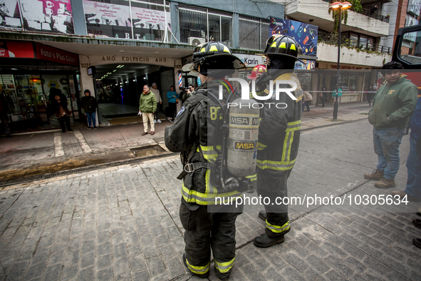 
Firefighters respond to a gas explosion emergency at a residential building in Osorno on July 26, 2023. 