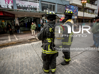 
Firefighters respond to a gas explosion emergency at a residential building in Osorno on July 26, 2023. (