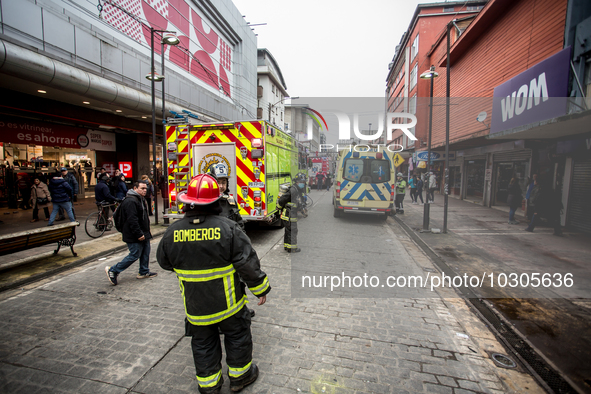 
Firefighters respond to a gas explosion emergency at a residential building in Osorno on July 26, 2023. 