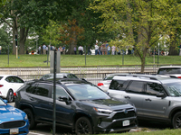 People wait to re-enter Senate office buildings as police respond to reports of an active shooter at or near the Russell Senate Office Build...