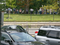 People wait to re-enter Senate office buildings as police respond to reports of an active shooter at or near the Russell Senate Office Build...