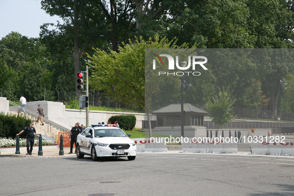 Police block an entrance to the U.S. Capitol grounds after reports of an active shooter at or near the Russell Senate Office Building in Was...