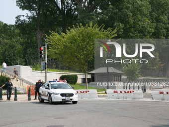 Police block an entrance to the U.S. Capitol grounds after reports of an active shooter at or near the Russell Senate Office Building in Was...