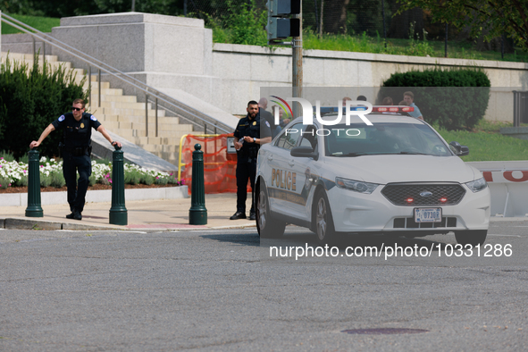 Police block an entrance to the U.S. Capitol grounds after reports of an active shooter at or near the Russell Senate Office Building in Was...