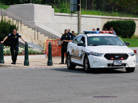 Police block an entrance to the U.S. Capitol grounds after reports of an active shooter at or near the Russell Senate Office Building in Was...