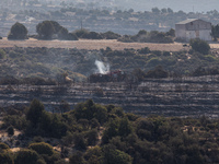 Firemen are patrolling around the area, Alassa, Cyprus, on Aug. 5, 2023. Fire Department and Forest Department units, patrol the area around...